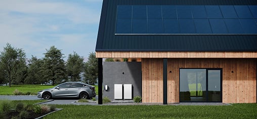 Tesla car sitting outside of house garage